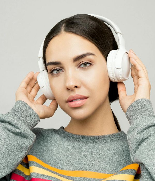 Beautiful young woman looking forward with relaxed facial muscles and clarity.